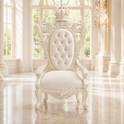 An ornate white throne chair with a crown on the backrest, set in a bright, classical room with marble floors and large windows.