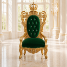 An ornate royal-style throne chair with carved gold metalwork and deep emerald green velvet upholstery, set in a bright palace interior with large windows and marble floors.