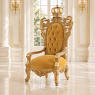 An ornate gold throne chair with a high tufted backrest and crown detail, set in a luxurious white and gold room with marble floors.